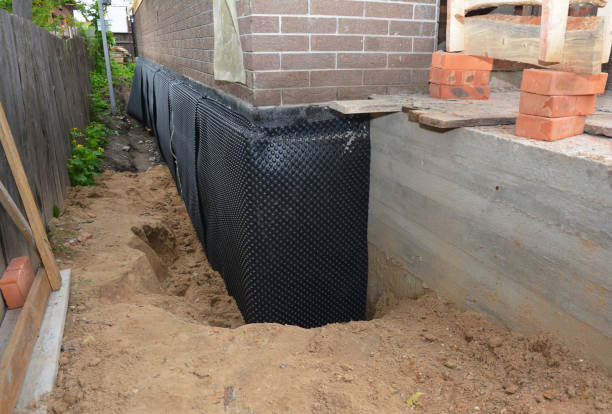 Happy homeowners after waterproofing job in Little Falls